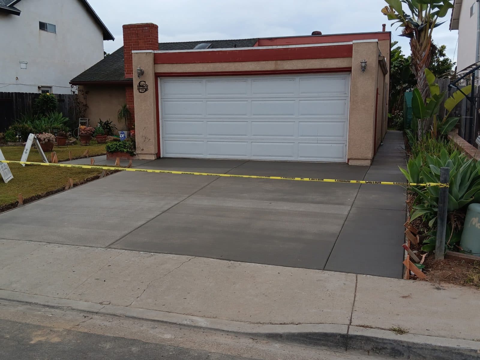 New concrete driveway on pour day with forms still set